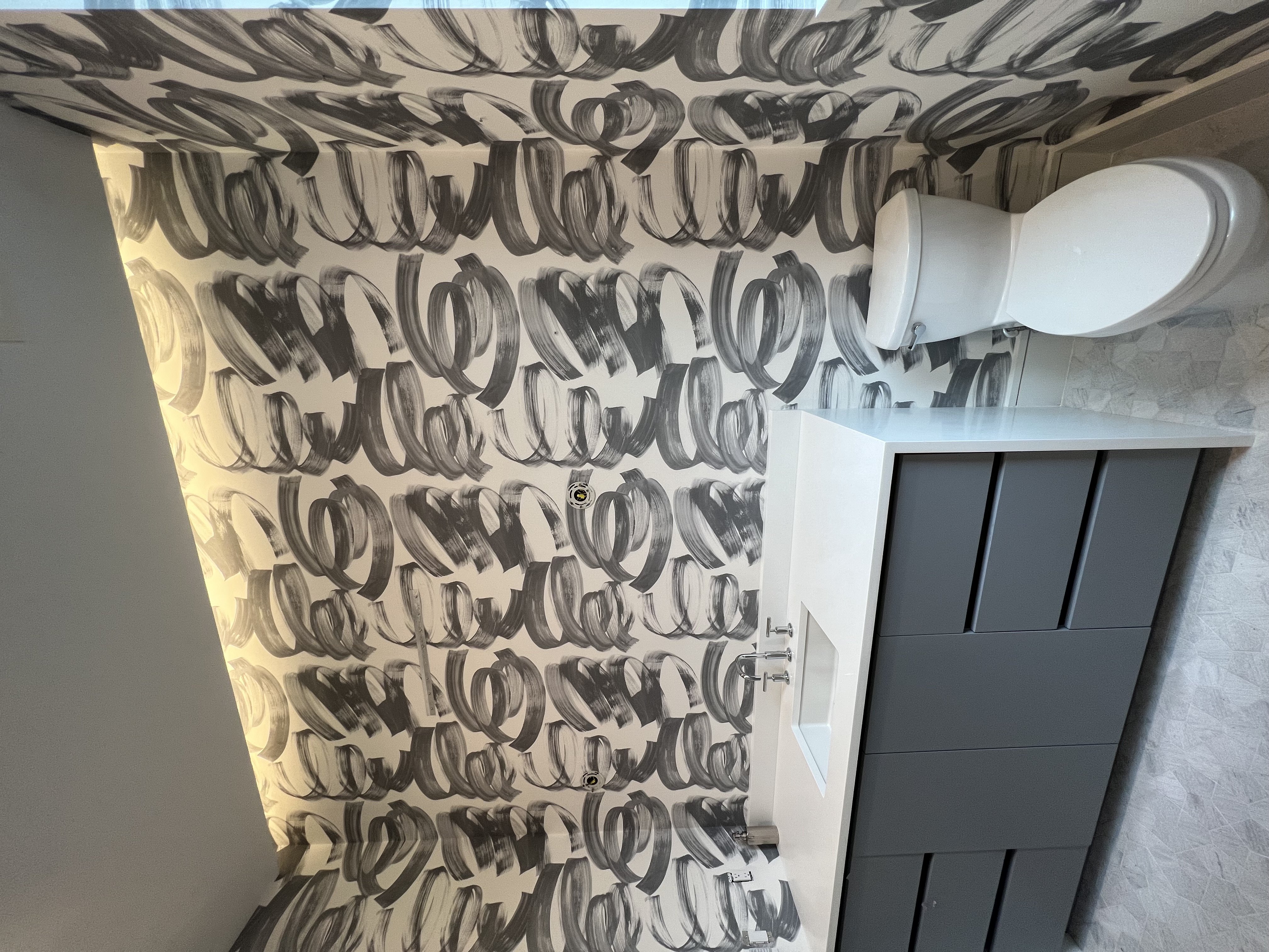 Guest bathroom wallpaper installation - Jacaranda Plantation